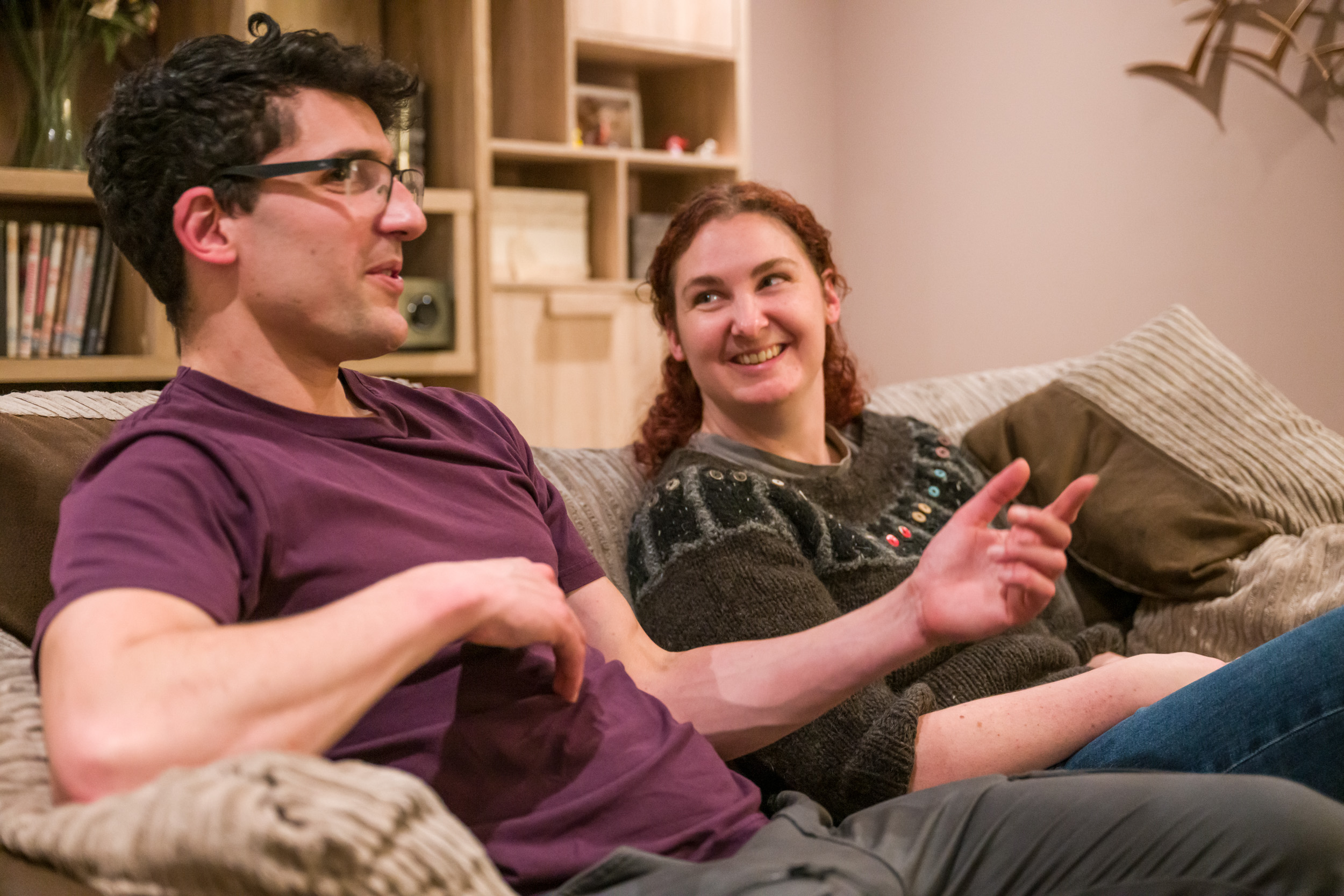 Volunteer couple from Open Homes Nottingham sharing a laugh, embodying the supportive and caring community for homeless youth in emergency accommodation.